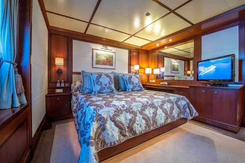 a bedroom with a large bed aboard LAUREN L Yacht for Sale
