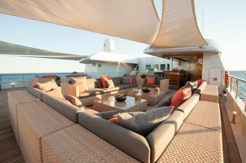 a living room with a large sofa aboard LAUREN L Yacht for Sale