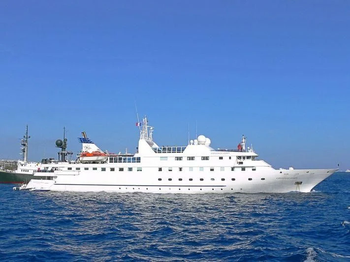 a large white ship in the water aboard LAUREN L Yacht for Sale