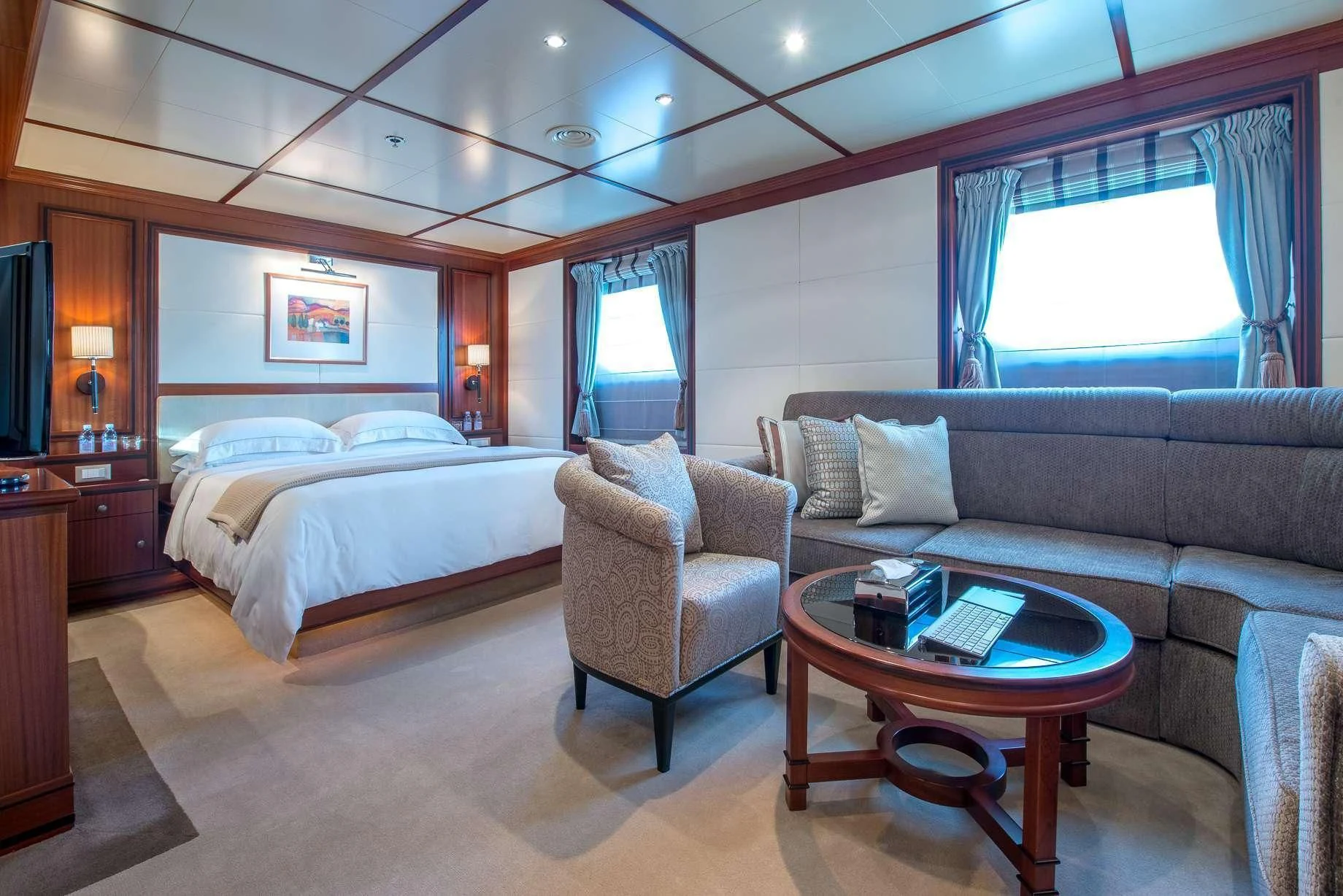 a hotel room with a bed and a coffee table aboard LAUREN L Yacht for Sale