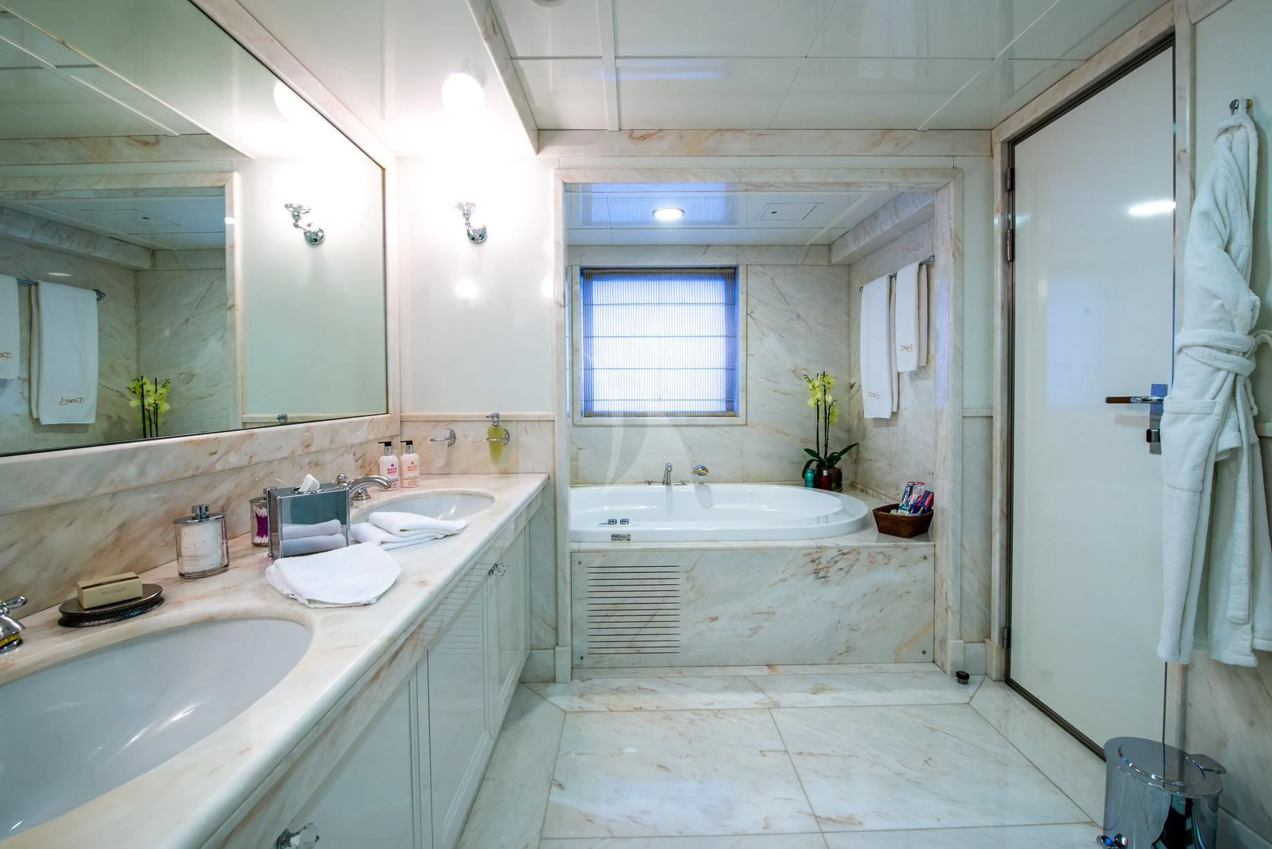 a bathroom with a tub sink and sinks aboard LAUREN L Yacht for Sale