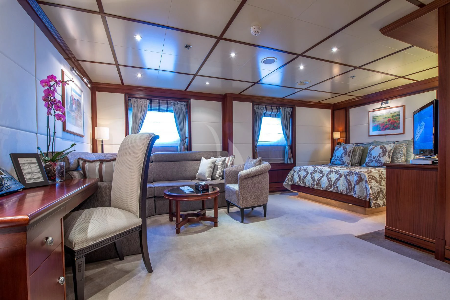 a living room with a couch and a tv aboard LAUREN L Yacht for Sale