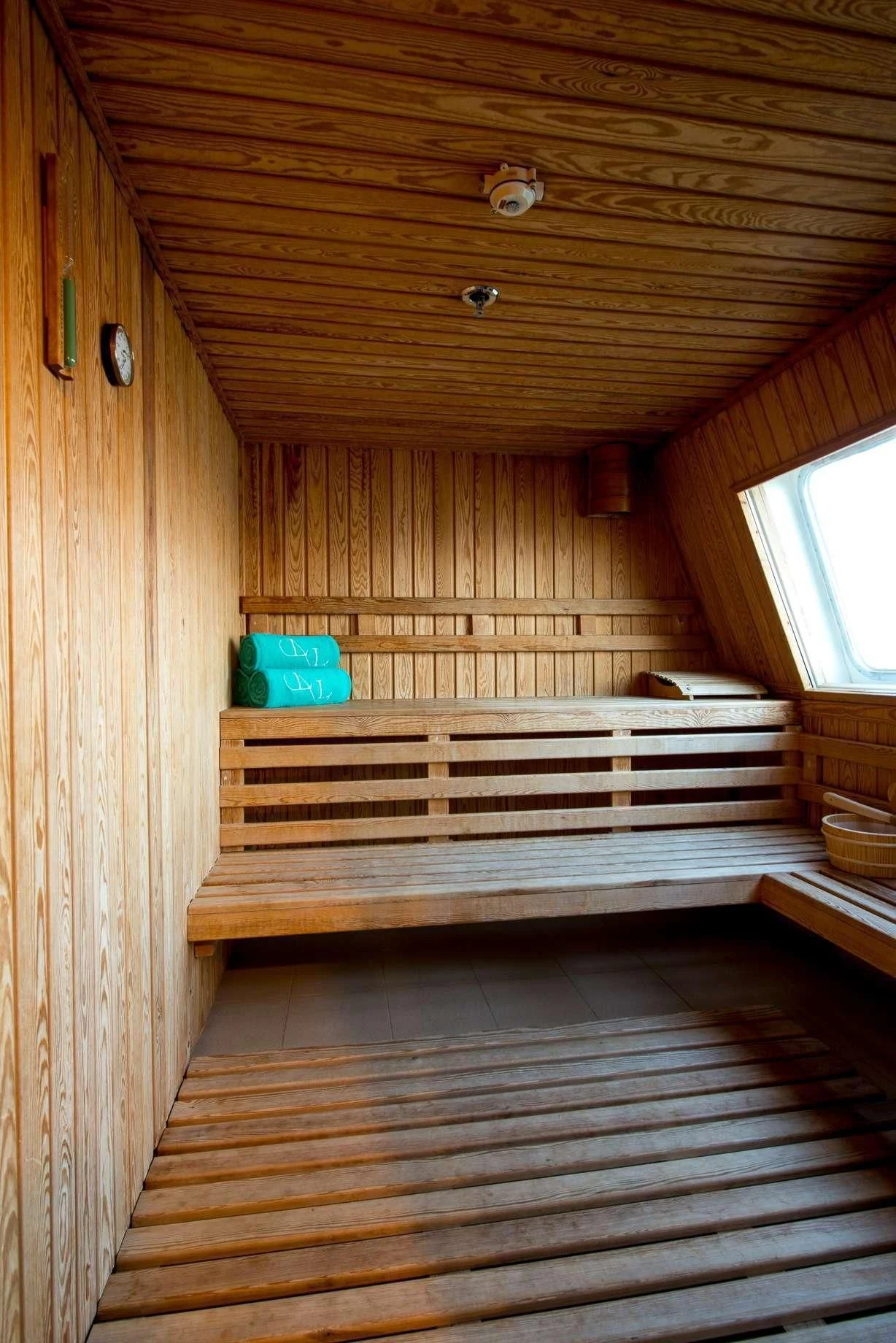 a wooden cabin with a bench aboard LAUREN L Yacht for Sale
