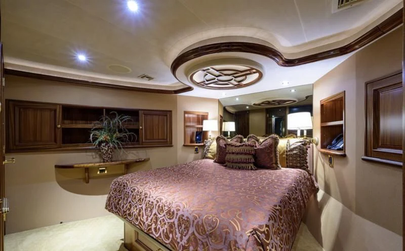 a large bedroom with a large bed aboard SYMPHONY Yacht for Sale