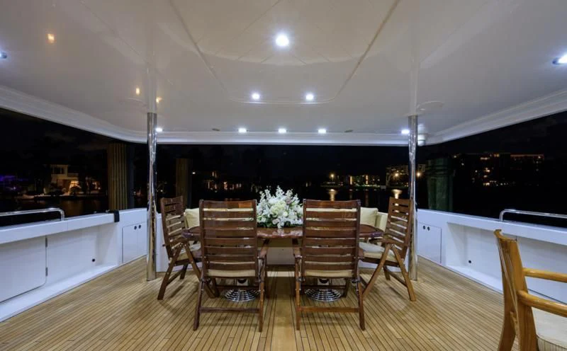 a dining room table and chairs aboard SYMPHONY Yacht for Sale