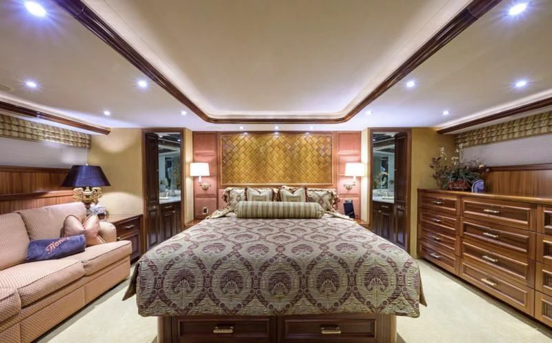 a large bedroom with a large bed aboard SYMPHONY Yacht for Sale
