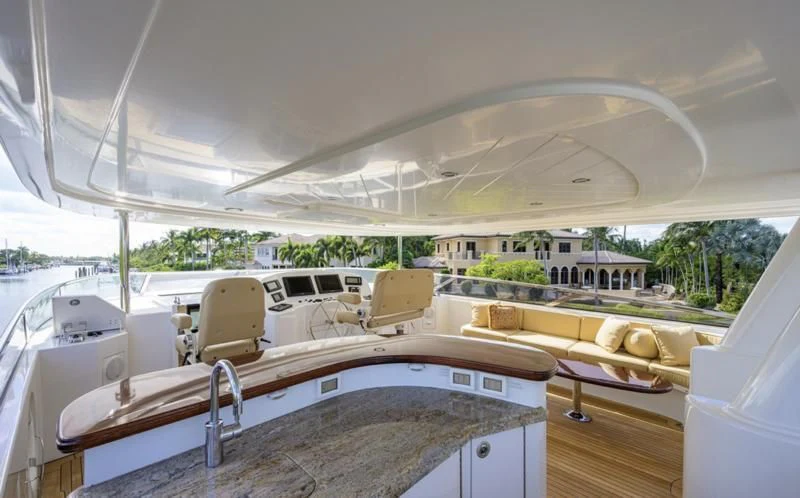 a large white tent with a table and chairs on it aboard SYMPHONY Yacht for Sale