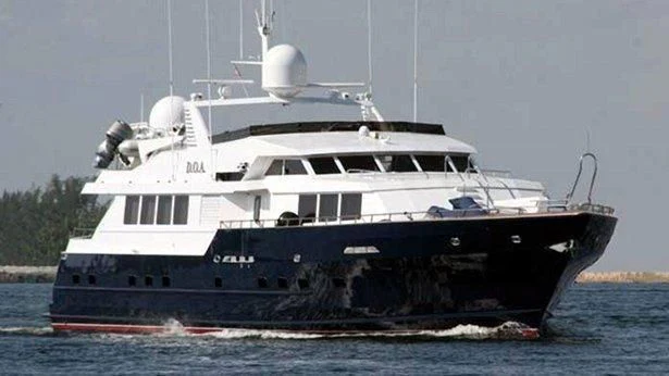 a large boat on the water aboard JAVA Yacht for Sale