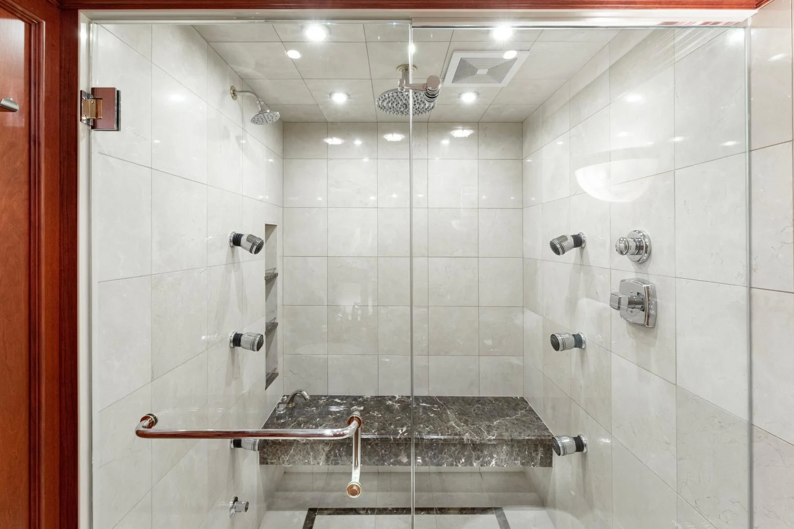 a bathroom with a shower and tub aboard SIMARON Yacht for Sale