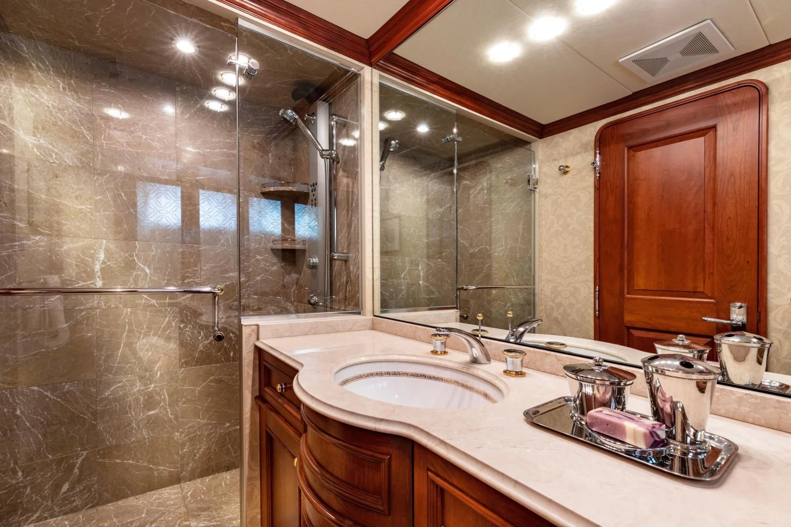 a bathroom with a large mirror aboard SIMARON Yacht for Sale