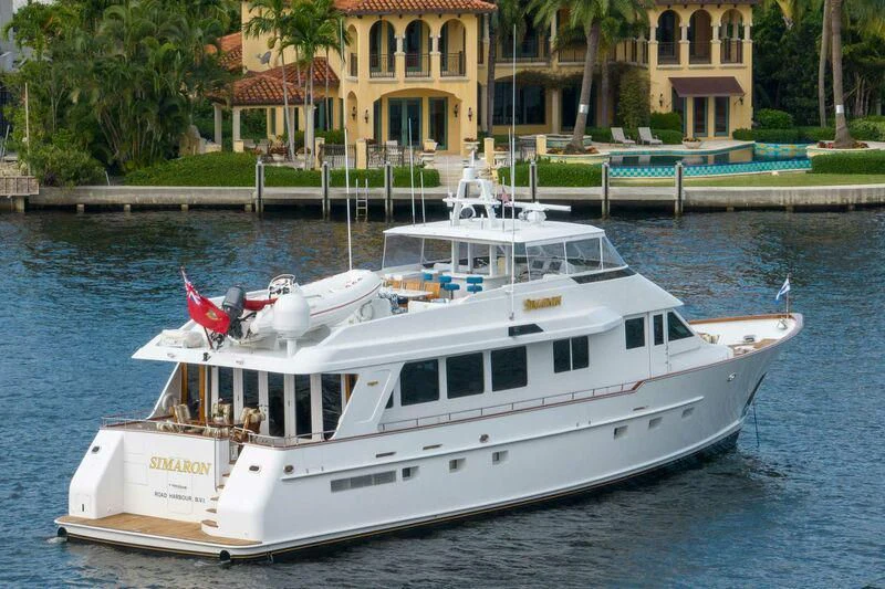 a white boat on a dock aboard SIMARON Yacht for Sale