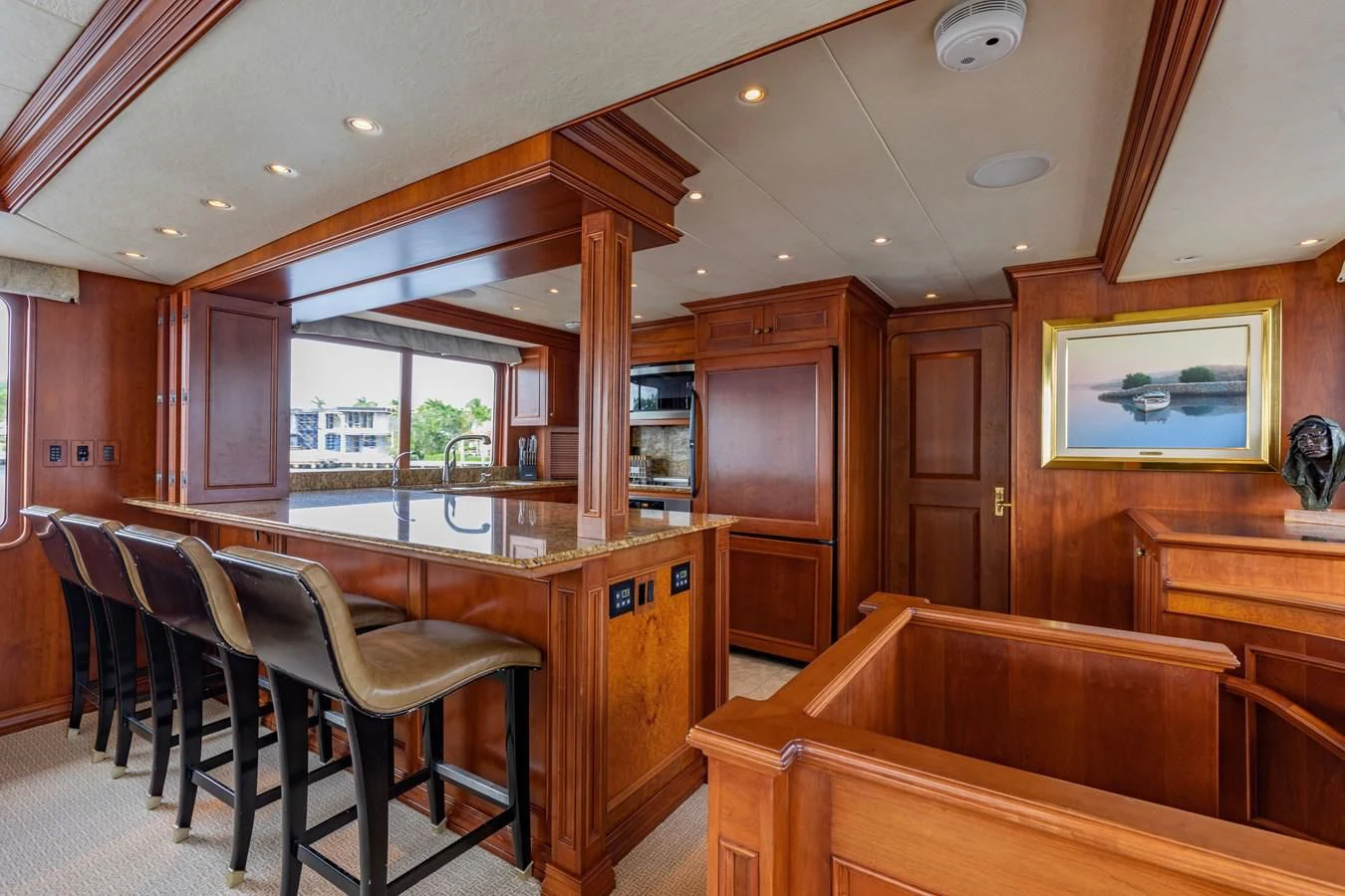 a large kitchen with wooden cabinets aboard SIMARON Yacht for Sale