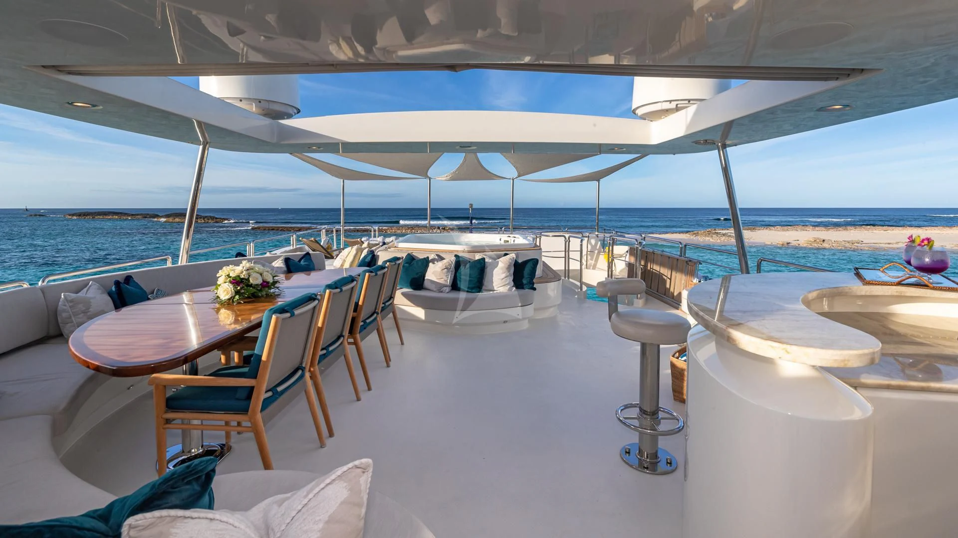 a table and chairs on a beach aboard SWEET EMOCEAN Yacht for Sale