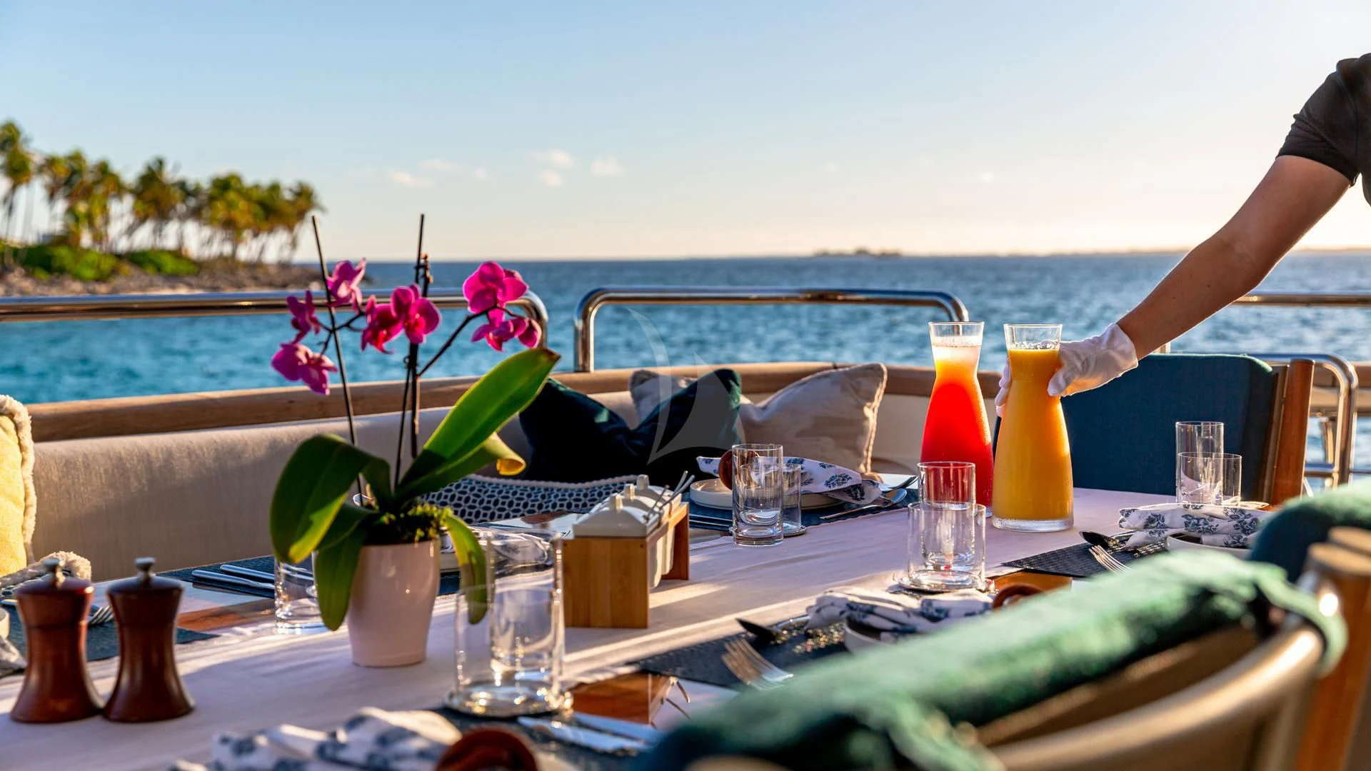 a table with glasses and flowers aboard SWEET EMOCEAN Yacht for Sale