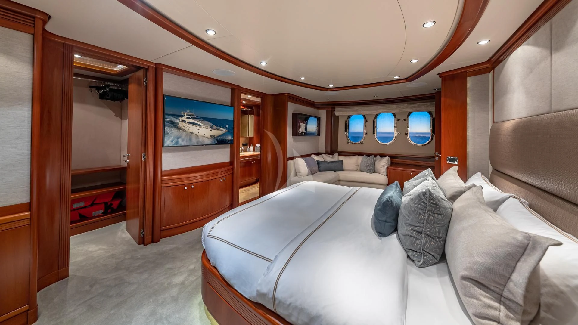 a room with a bed and a mirror aboard SWEET EMOCEAN Yacht for Sale
