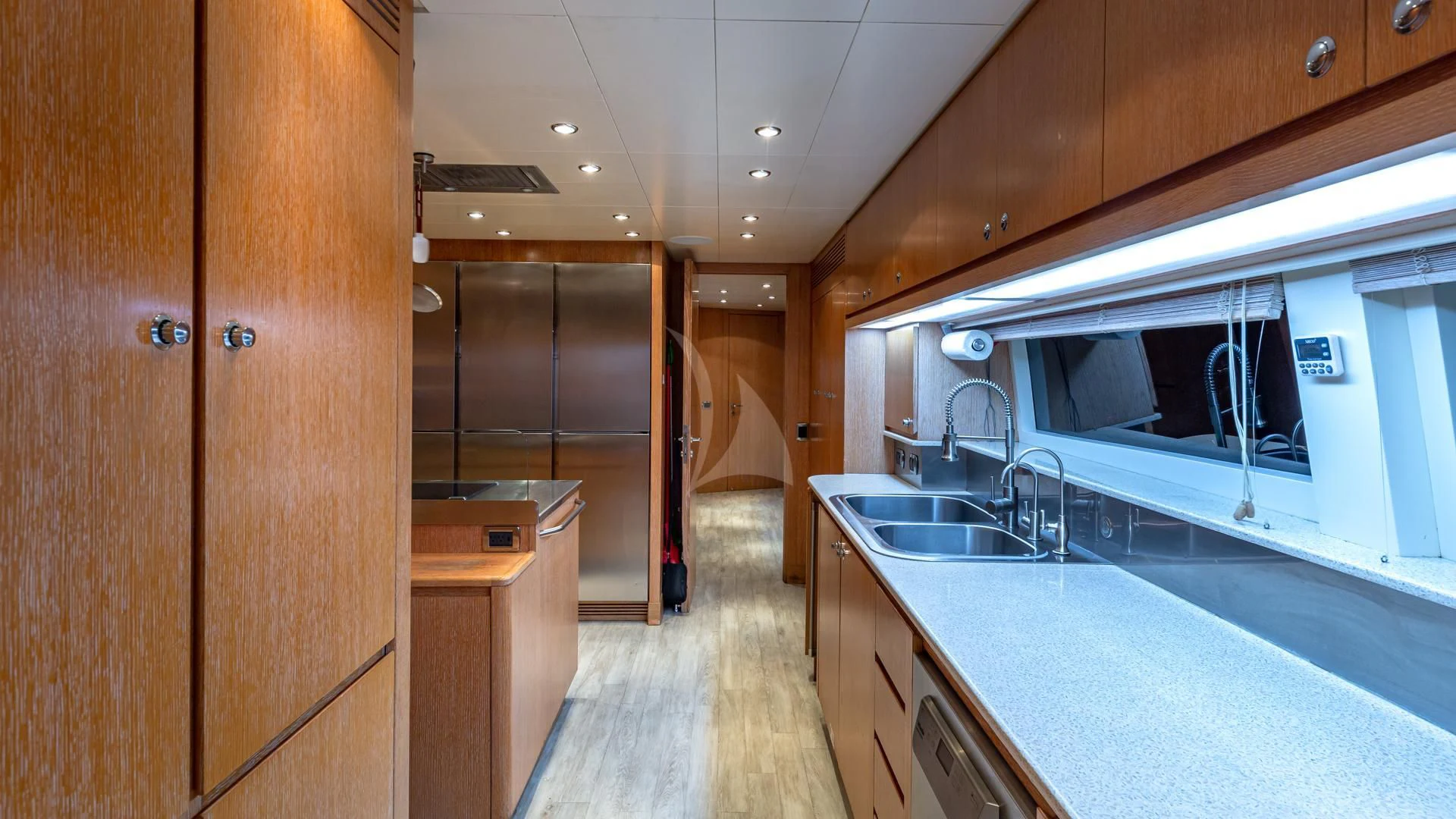 a kitchen with a large island aboard SWEET EMOCEAN Yacht for Sale
