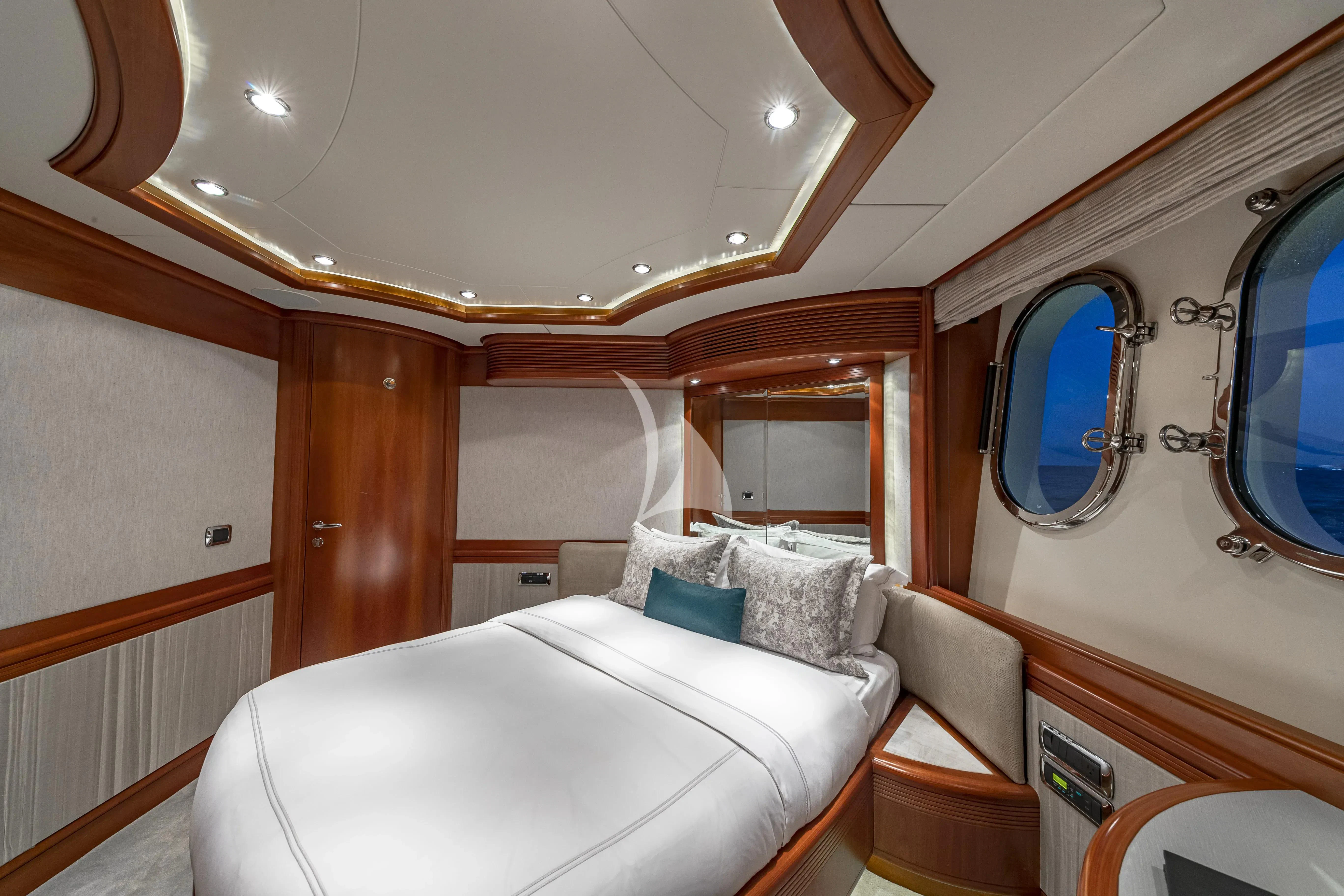 a room with a bed and a mirror aboard SWEET EMOCEAN Yacht for Sale
