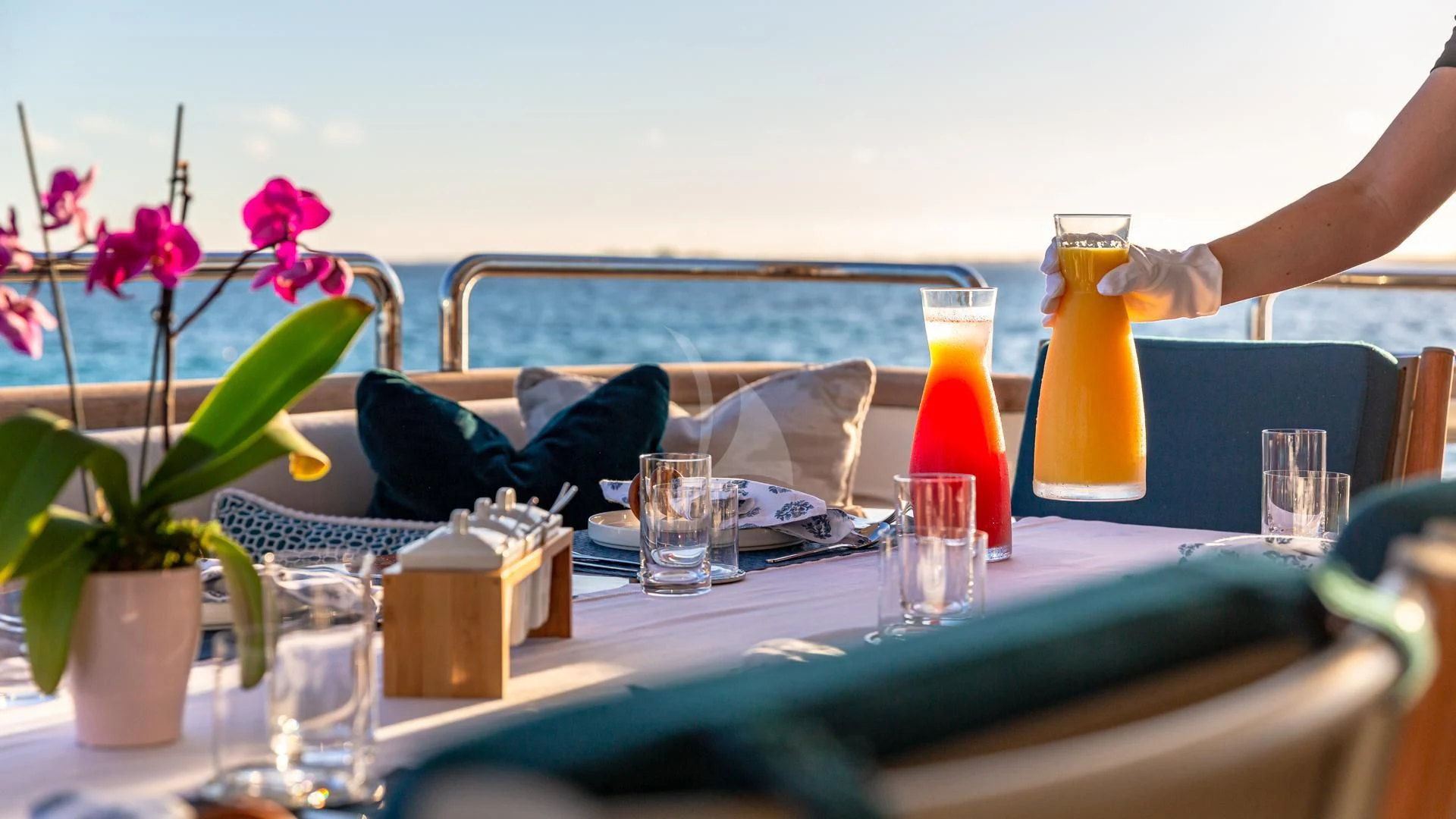 a table with glasses and bottles aboard SWEET EMOCEAN Yacht for Sale