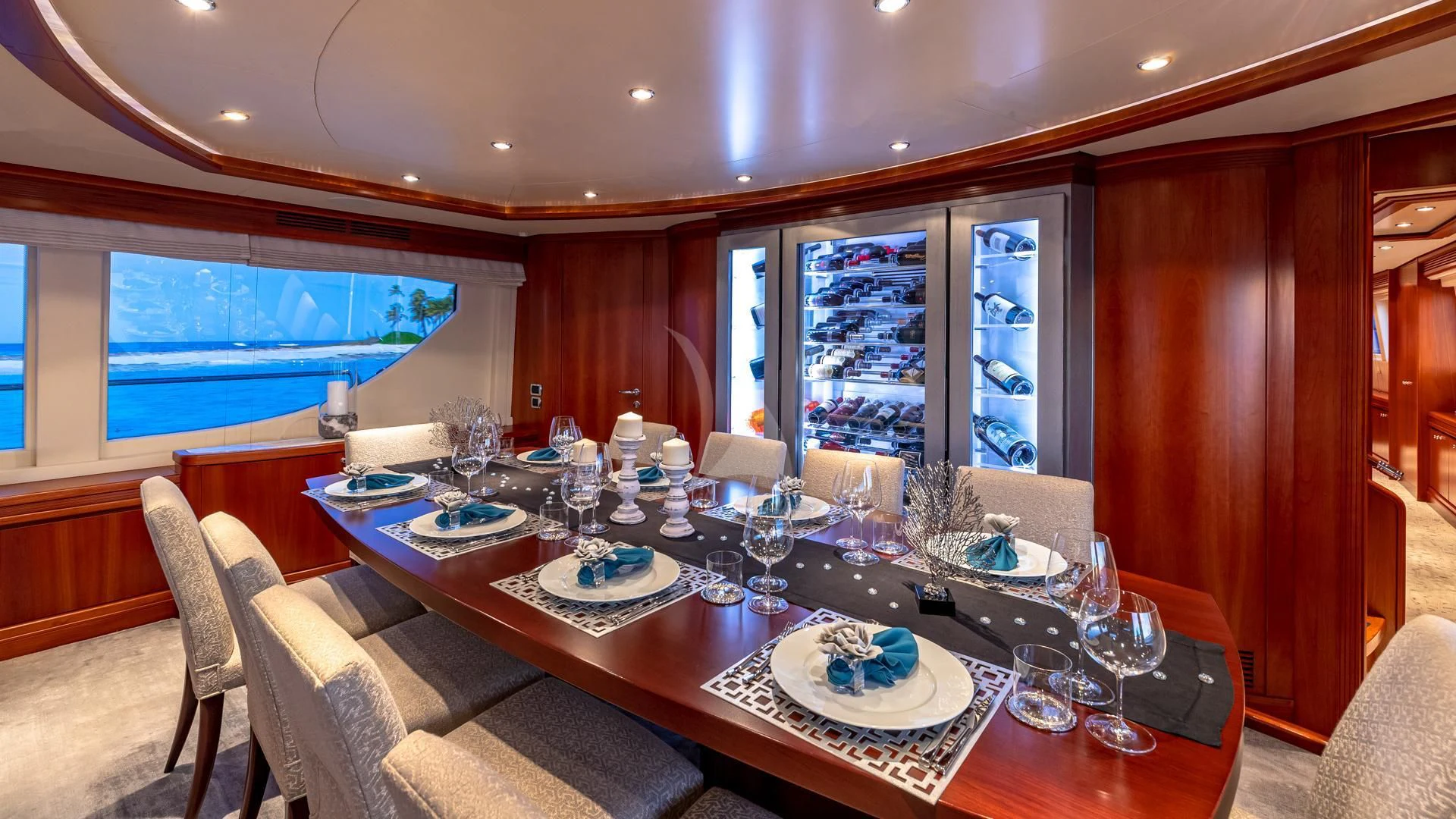 a dining table with plates and glasses aboard SWEET EMOCEAN Yacht for Sale