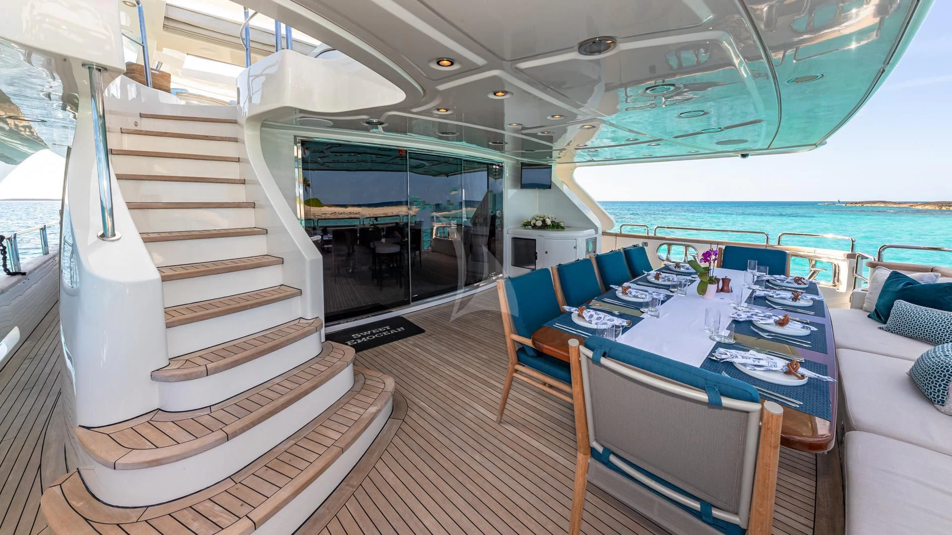 a boat with a staircase and tables aboard SWEET EMOCEAN Yacht for Sale