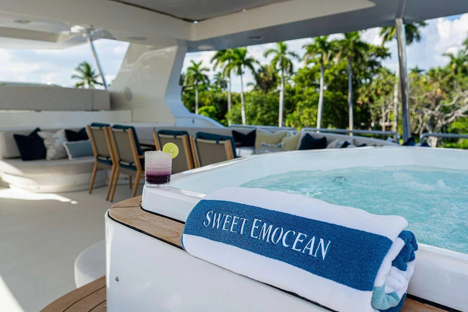 a pool table with chairs and umbrellas aboard SWEET EMOCEAN Yacht for Sale
