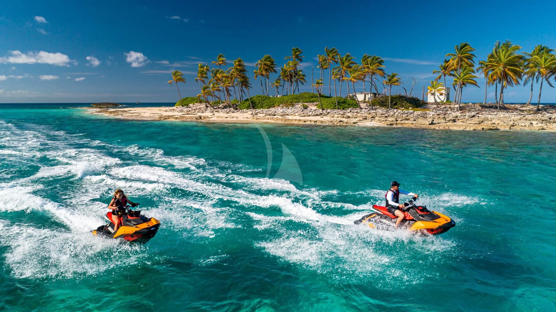 a couple of people on a jet ski in the ocean aboard SWEET EMOCEAN Yacht for Sale