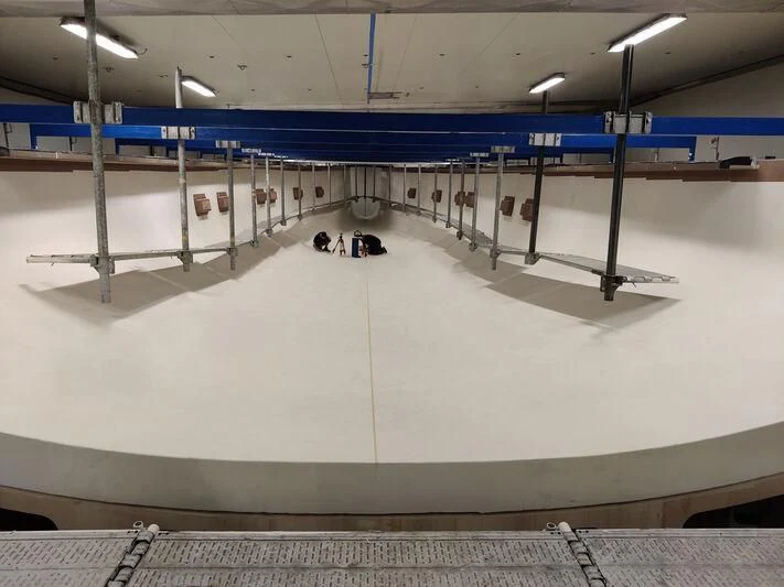 a large white room with a large white floor and a few lights aboard GALMA Yacht for Sale