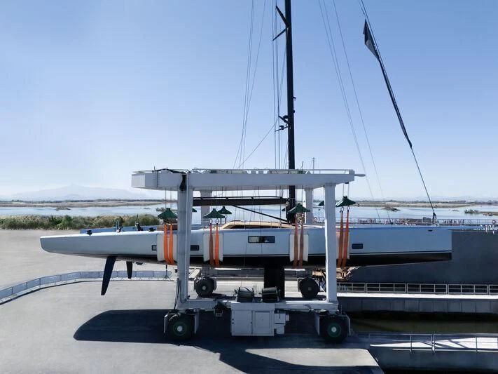 a white boat on a trailer aboard GALMA Yacht for Sale