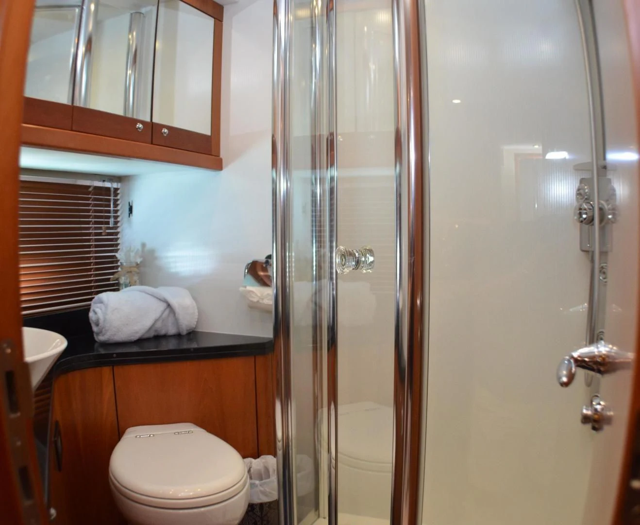 a bathroom with a glass shower aboard PEARL Yacht for Sale