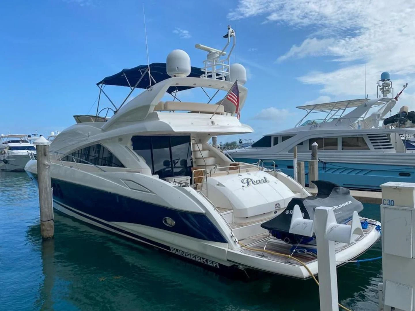 a large white boat docked aboard PEARL Yacht for Sale