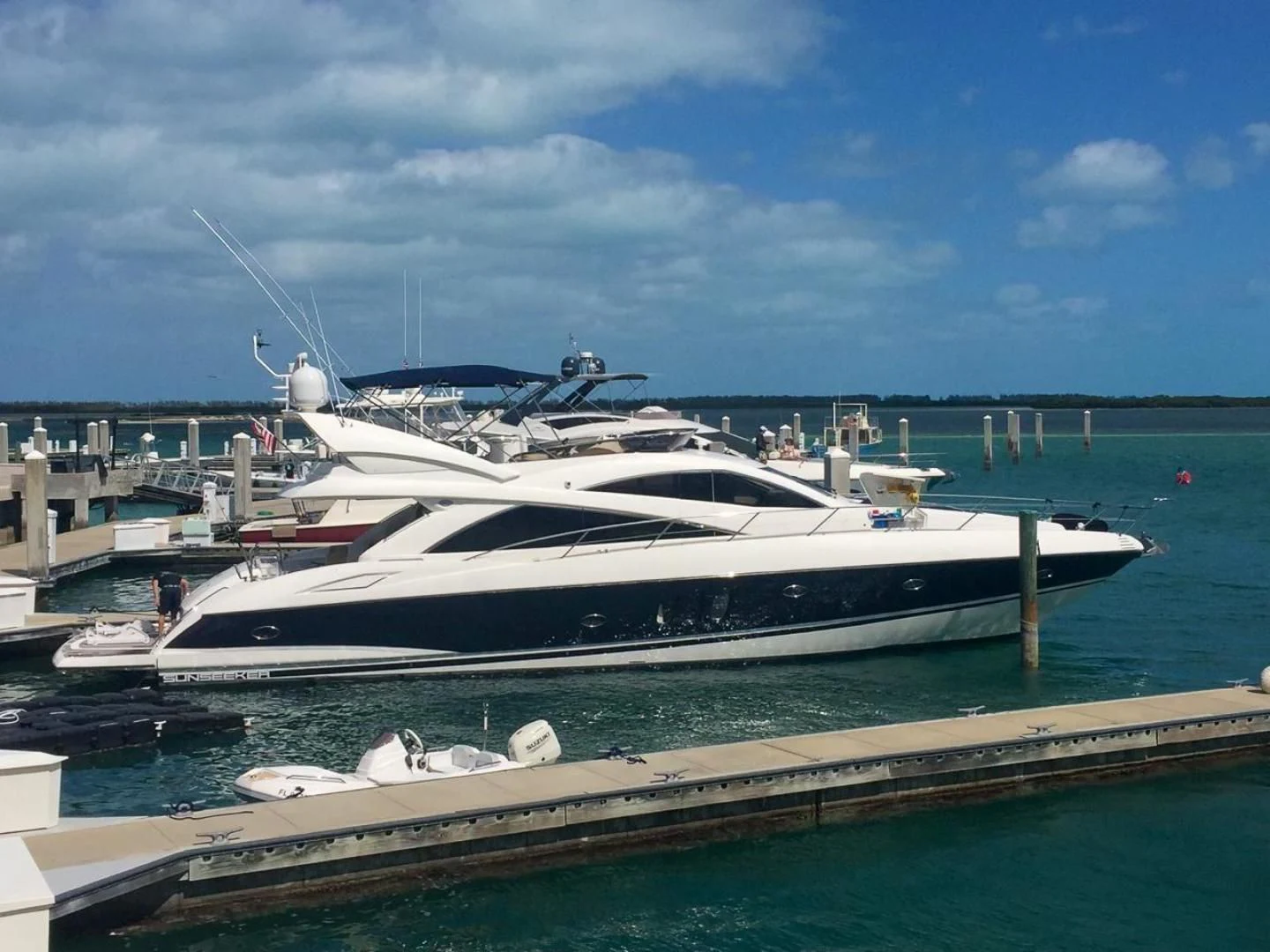 a yacht docked at a pier aboard PEARL Yacht for Sale