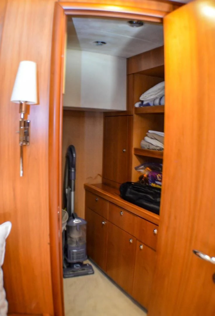 a room with a bed and a guitar aboard PEARL Yacht for Sale