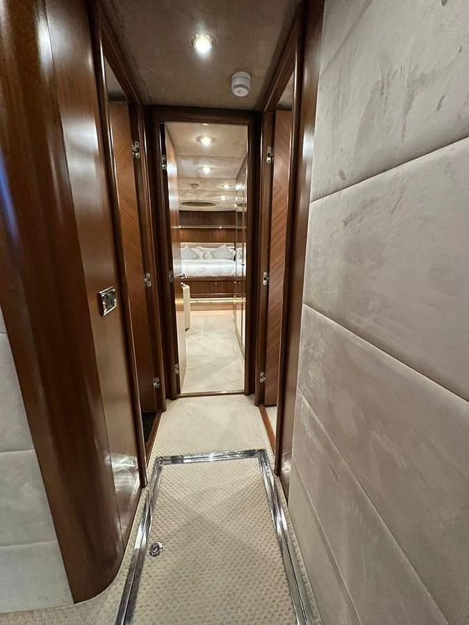 a hallway with a glass door aboard MILA DUBAI Yacht for Sale