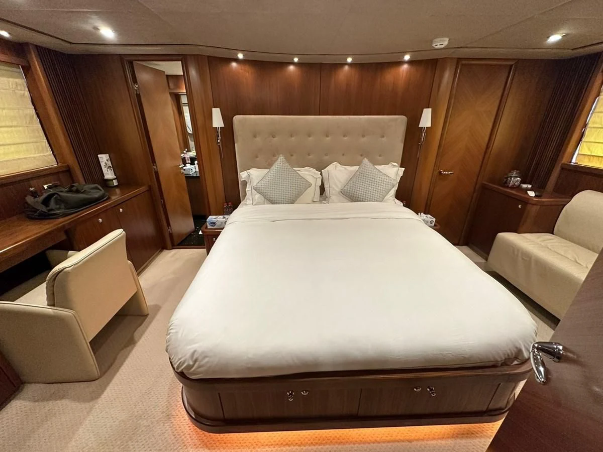 a bed in a room aboard MILA DUBAI Yacht for Sale