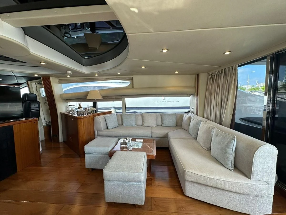 a living room with a large window aboard MILA DUBAI Yacht for Sale