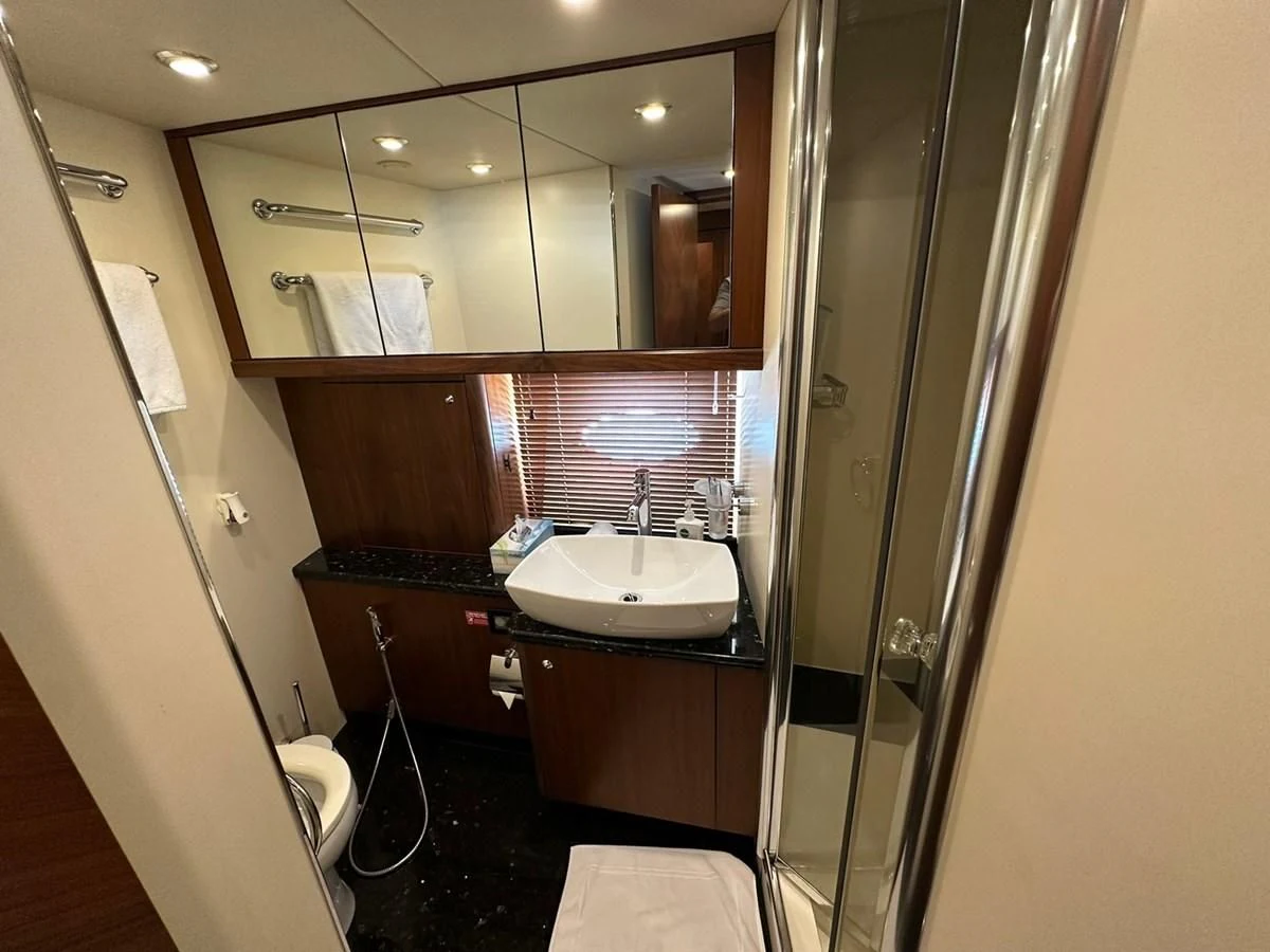 a bathroom with a sink and a mirror aboard MILA DUBAI Yacht for Sale