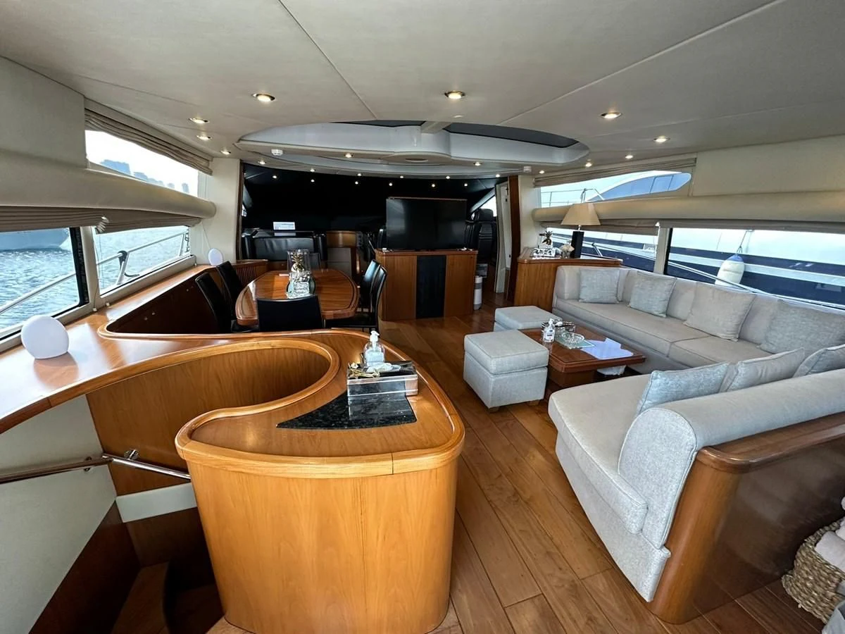 a living room with a large window aboard MILA DUBAI Yacht for Sale