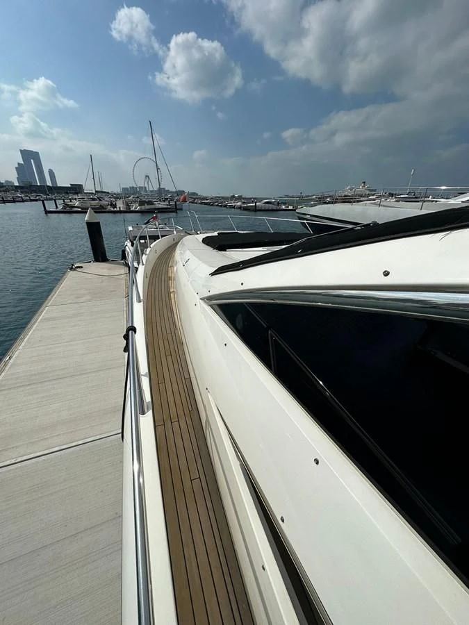 a boat is parked on the side of the water aboard MILA DUBAI Yacht for Sale