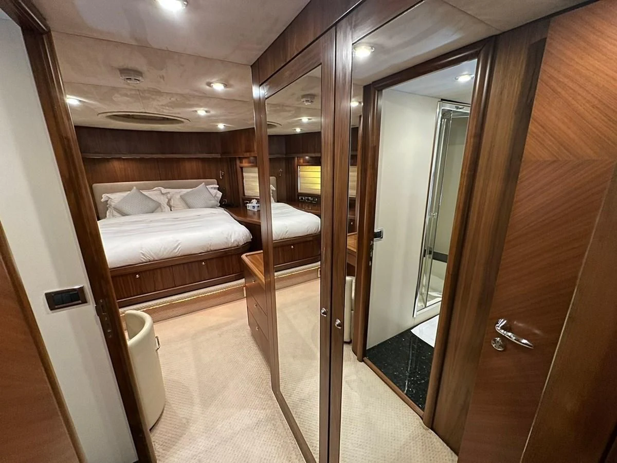 a bathroom with a glass shower aboard MILA DUBAI Yacht for Sale