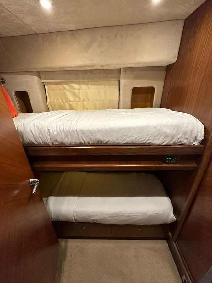 a bed with a white sheet aboard MILA DUBAI Yacht for Sale