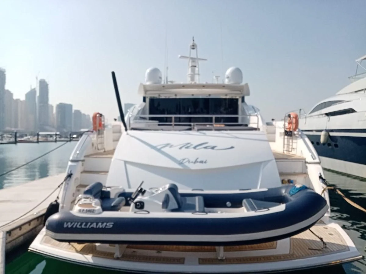 a couple of boats sit in a harbor aboard MILA DUBAI Yacht for Sale