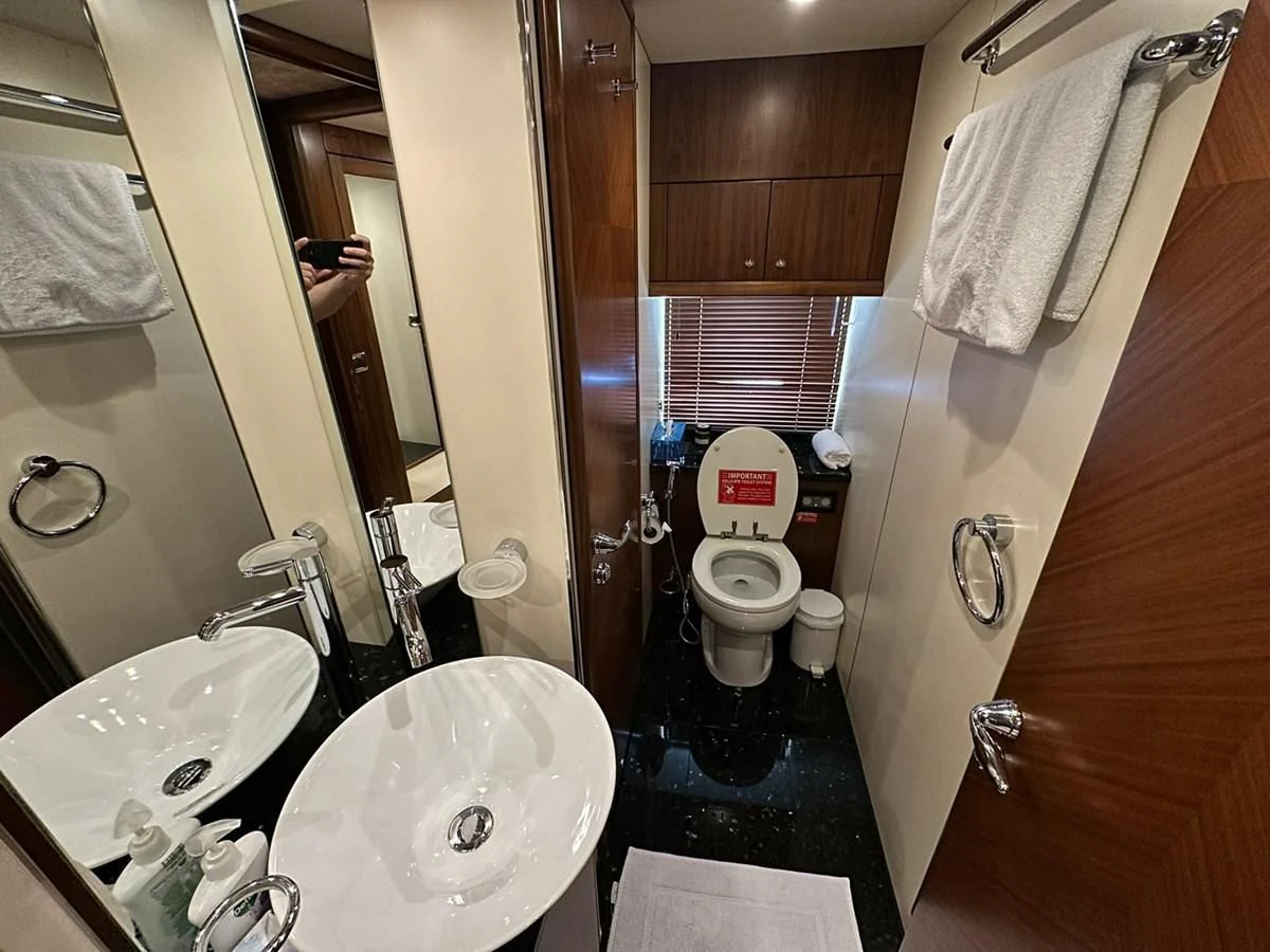 a bathroom with a toilet sink and a bathtub aboard MILA DUBAI Yacht for Sale