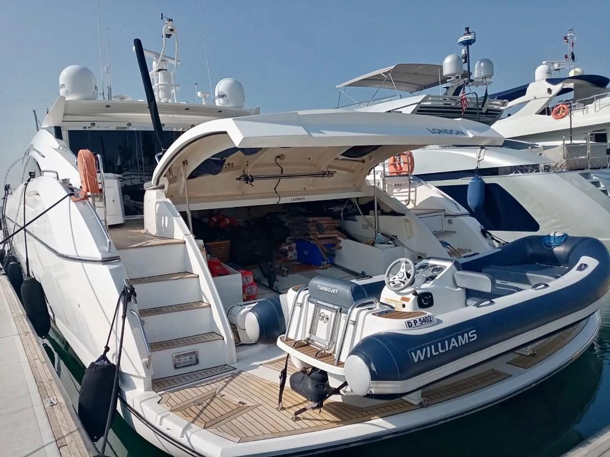 a boat docked at a pier aboard MILA DUBAI Yacht for Sale