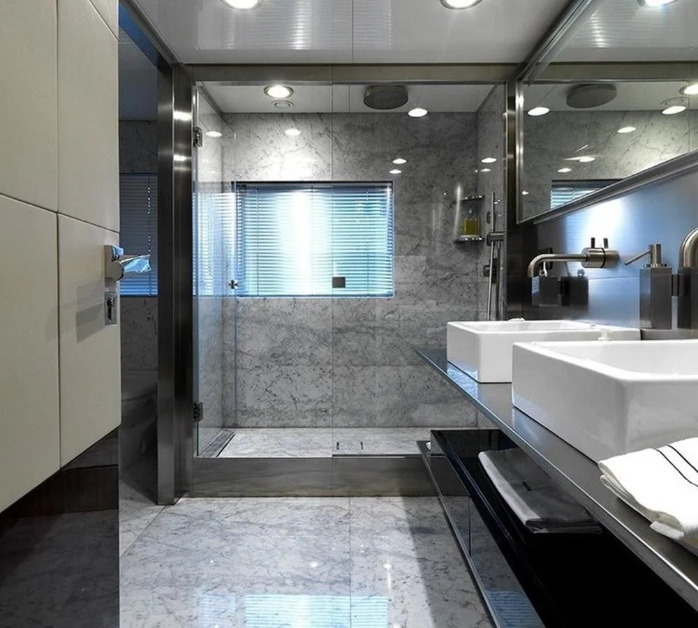 a bathroom with a glass shower aboard LADY IN BLUE Yacht for Sale