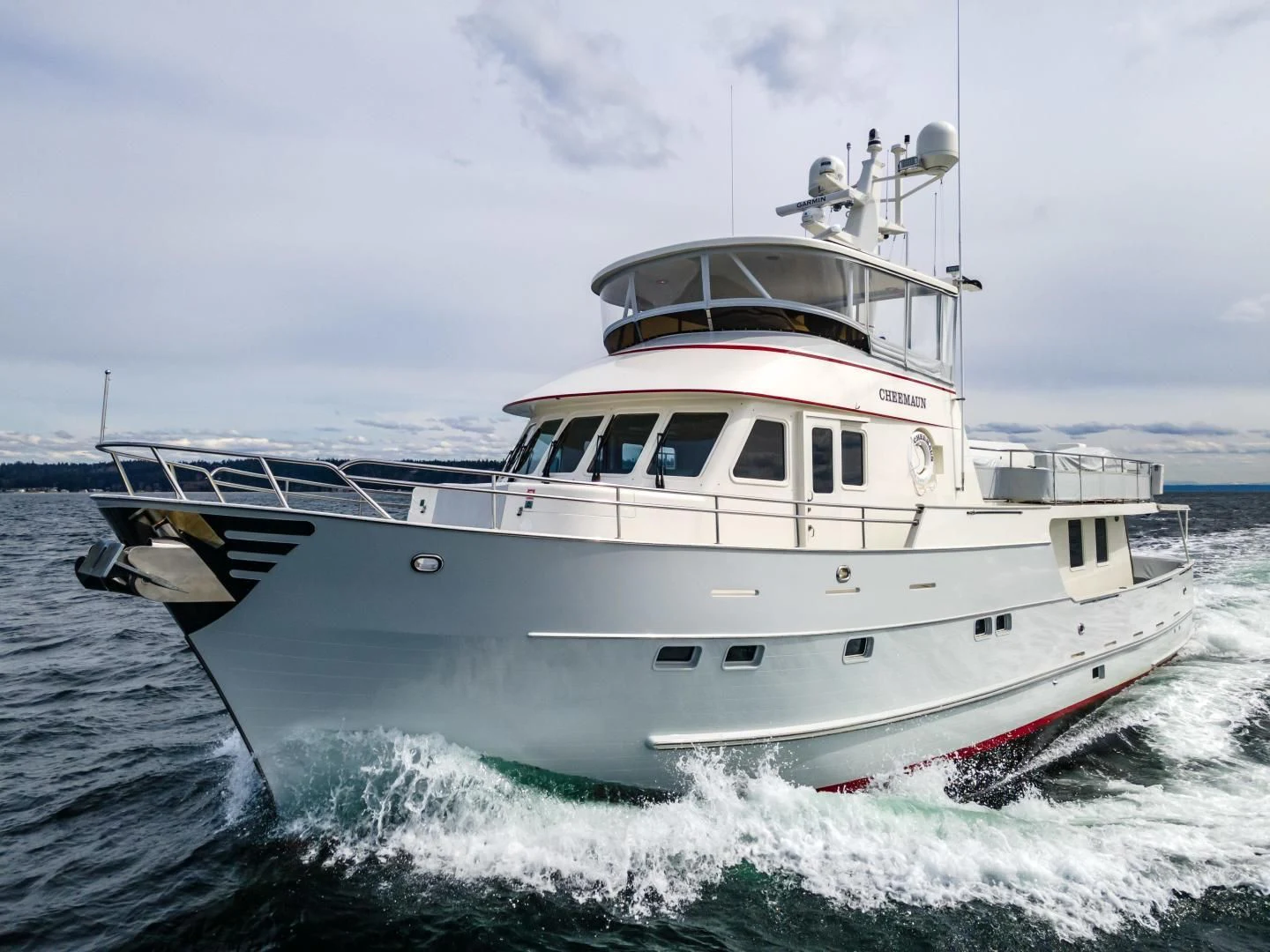 a white boat in the water aboard CHEEMAUN Yacht for Sale