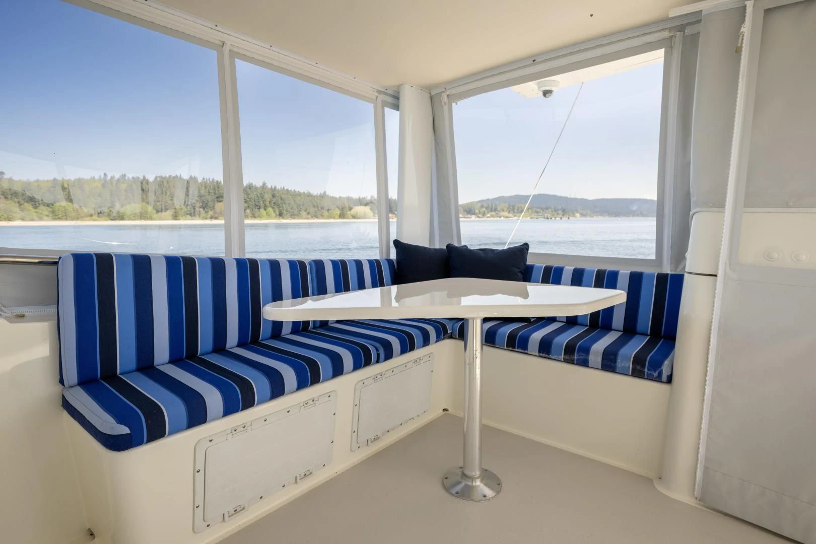 a room with a couch and a window aboard CHEEMAUN Yacht for Sale