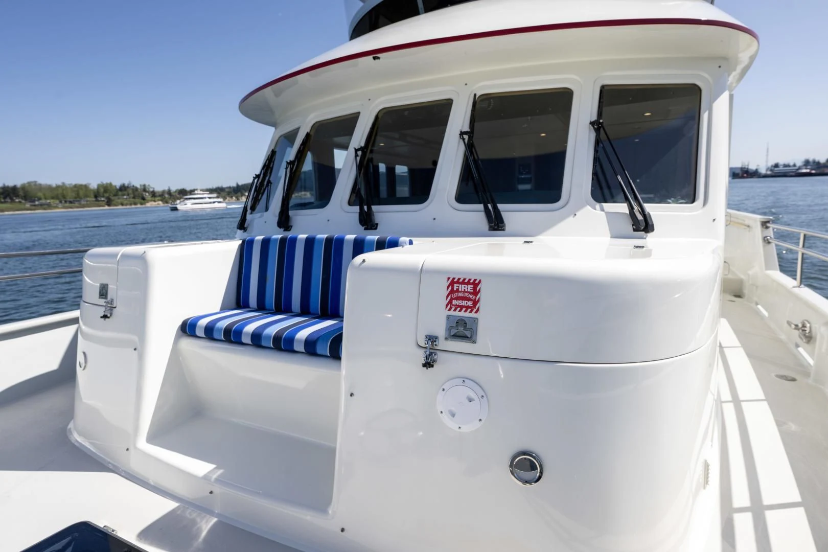 a white boat on a body of water aboard CHEEMAUN Yacht for Sale