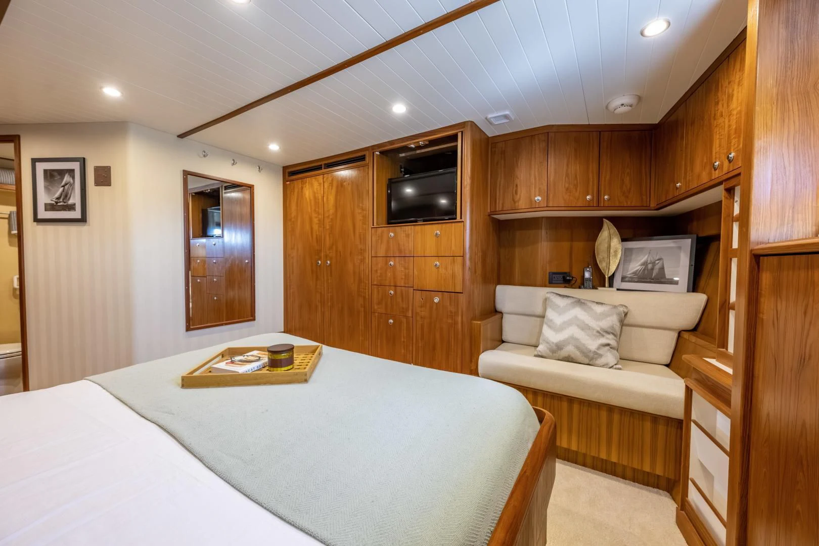 a room with a bed and a table aboard CHEEMAUN Yacht for Sale