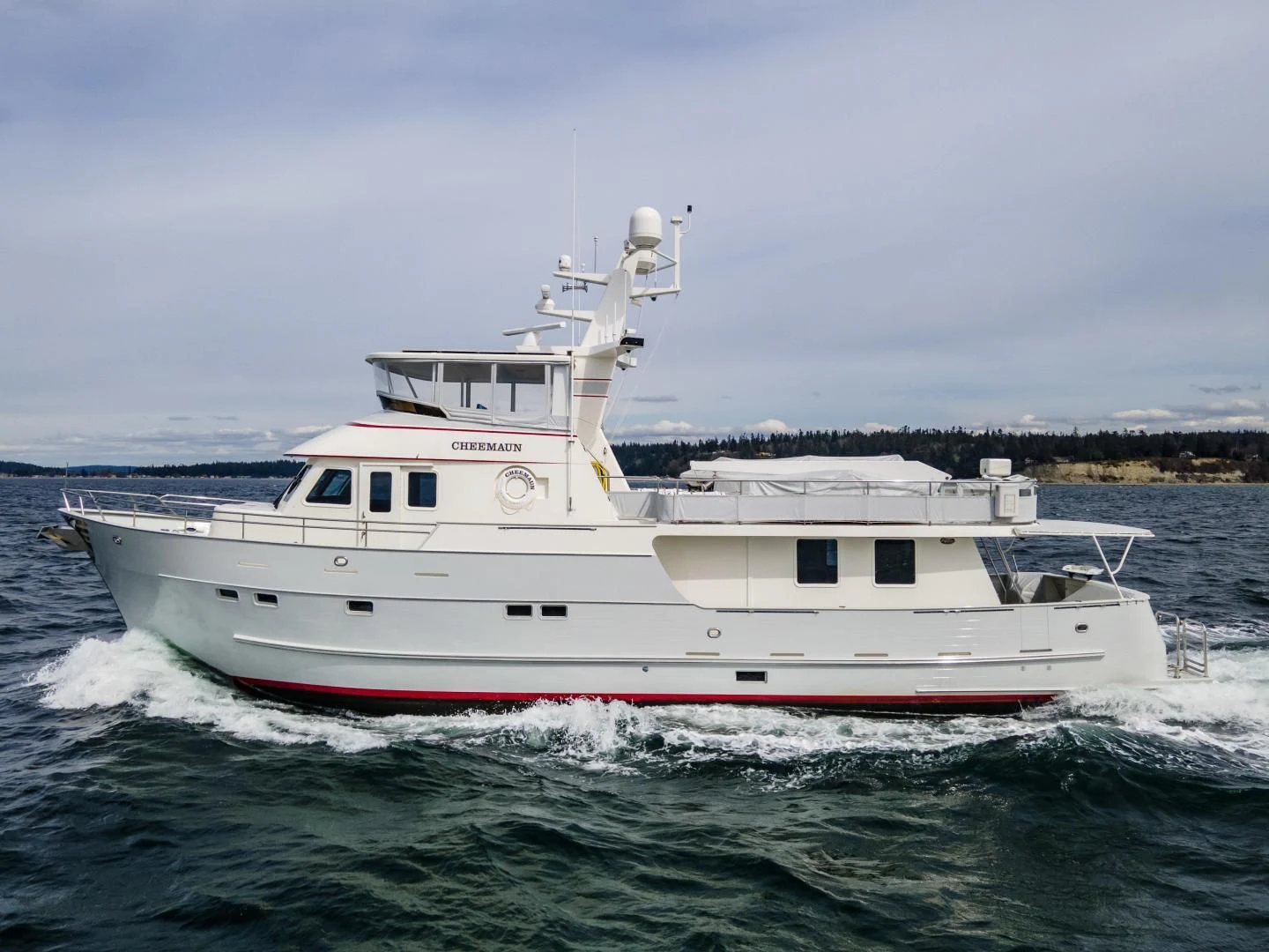 a white boat in the water aboard CHEEMAUN Yacht for Sale
