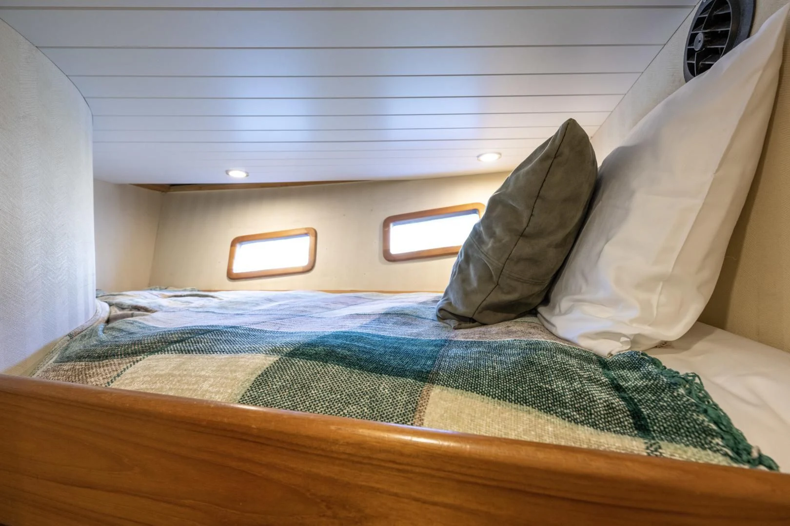 a bed with a pillow and a pillow on it aboard CHEEMAUN Yacht for Sale